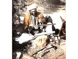A woodworker of Jerusalem. Holes were bored with a drill worked by a bow and string. An early photograph.